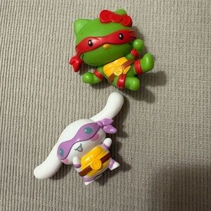 Hello Kitty Action Figures - Green, Red, and Purple